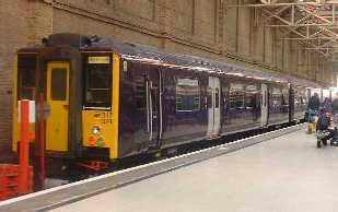 picture of All Over Purple Livered class 317 at Kings Cross 