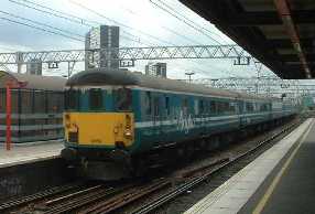 Picture of an Anglia Livered Mk 2f DBSO leading a train through Stratford
